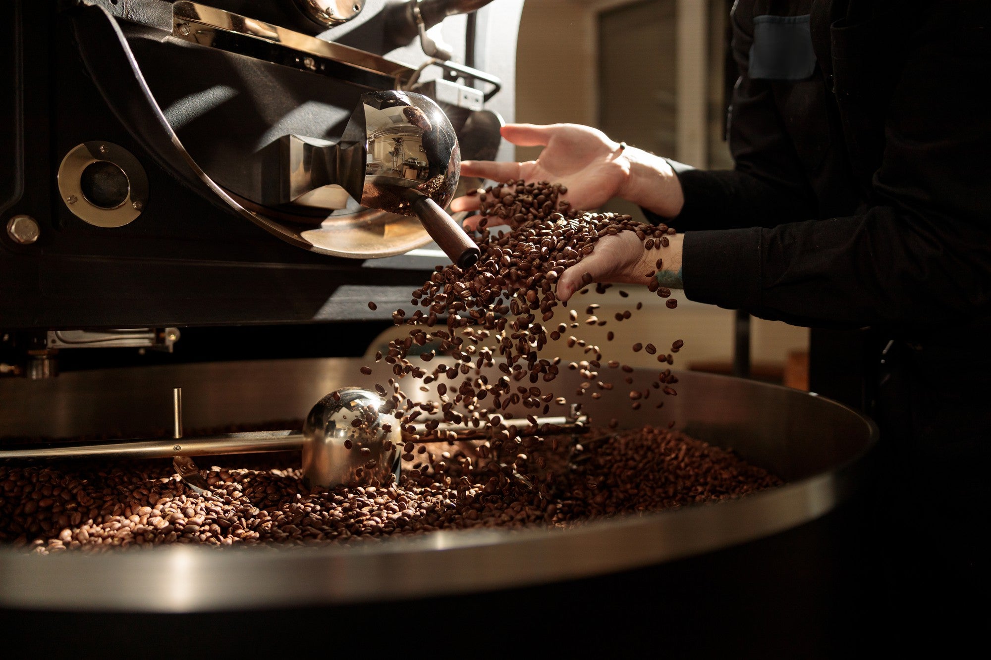 coffee beans being roasted by master roaster